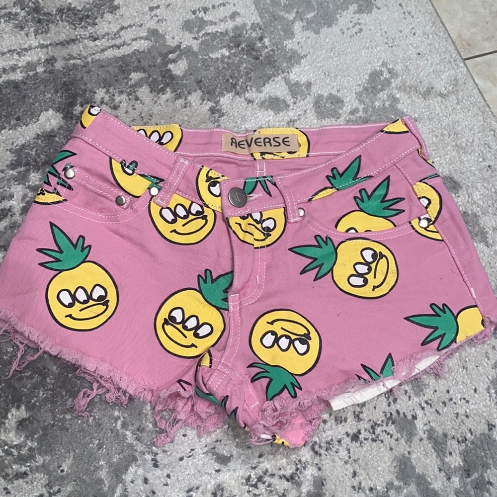 Reverse pink pineapple graphic denim shorts